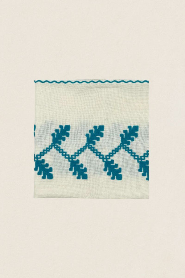 Serviette brodée turquoise