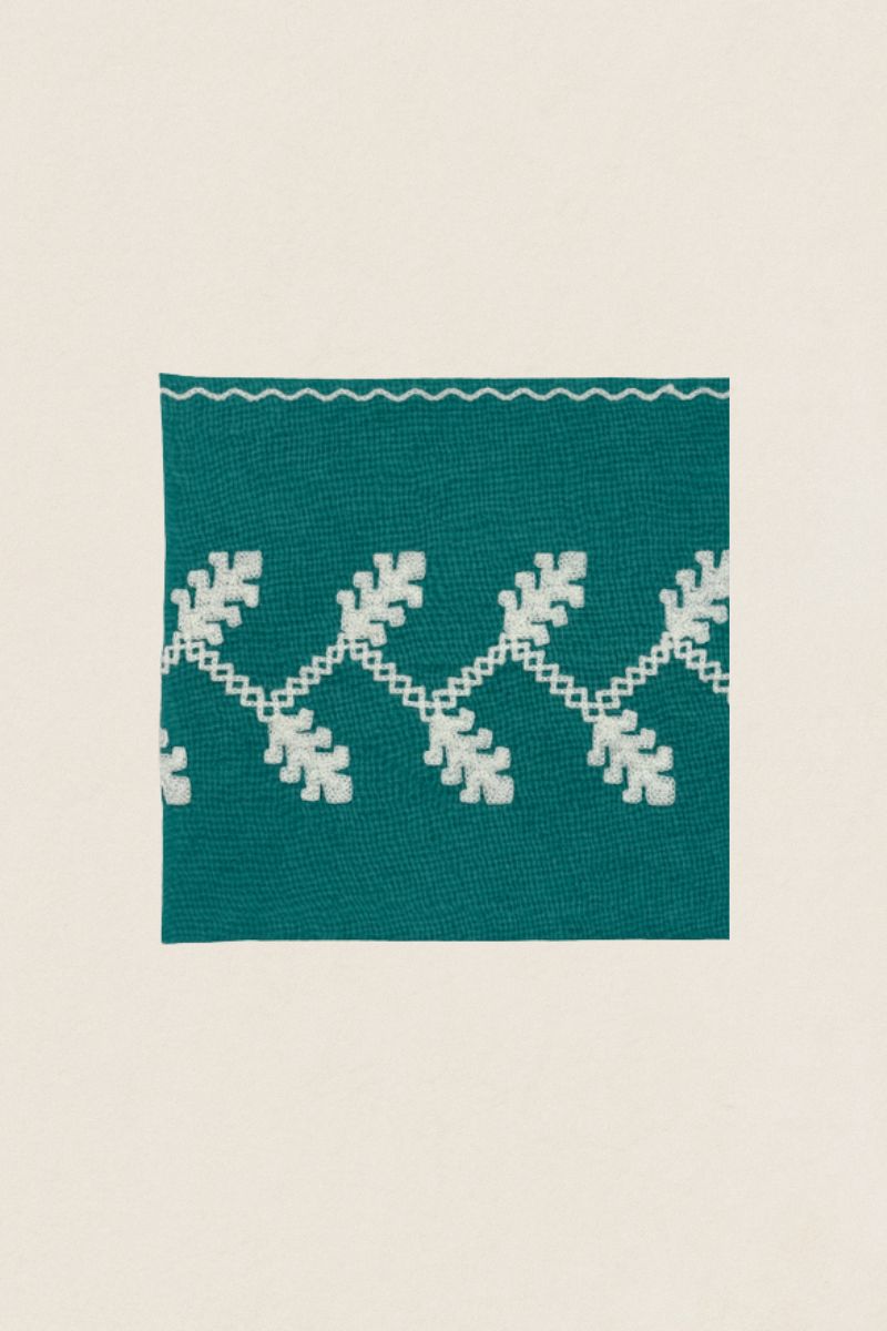 White / turquoise embroidered napkin